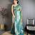 Teal green tissue silk floral pattern with copper motifs banarasi saree