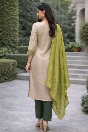 Off white color jaquard silk fabric designer ceremonial ethnic readymade suit