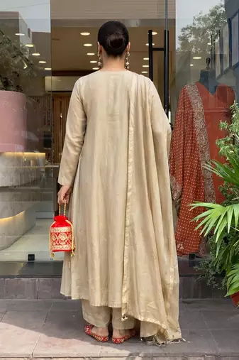 Beige color stylish trendy looking kurta set for stylish looks