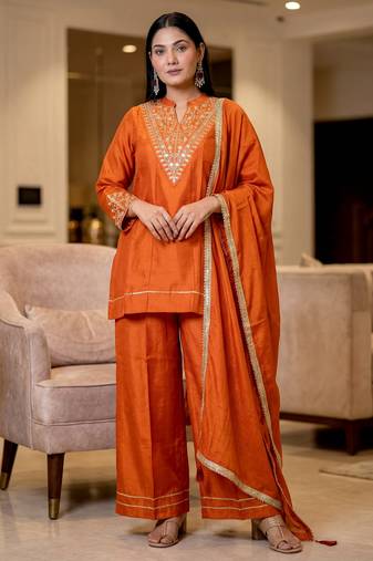 Orange color stylish trendy looking designer kurta set for stylish looks
