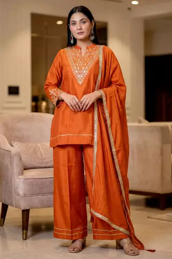 Orange color stylish trendy looking designer kurta set for stylish looks