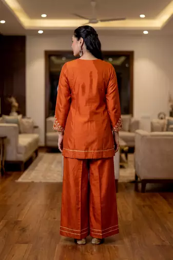 Orange color stylish trendy looking kurta set for stylish looks