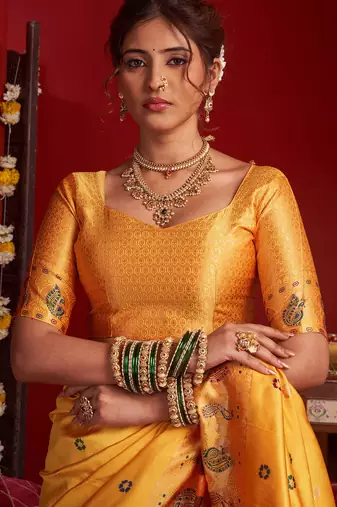 Light orange silk floral motifs woven work paithani saree