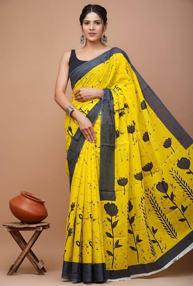 Yellow soft mul cotton saree with unstiched attached blouse piece