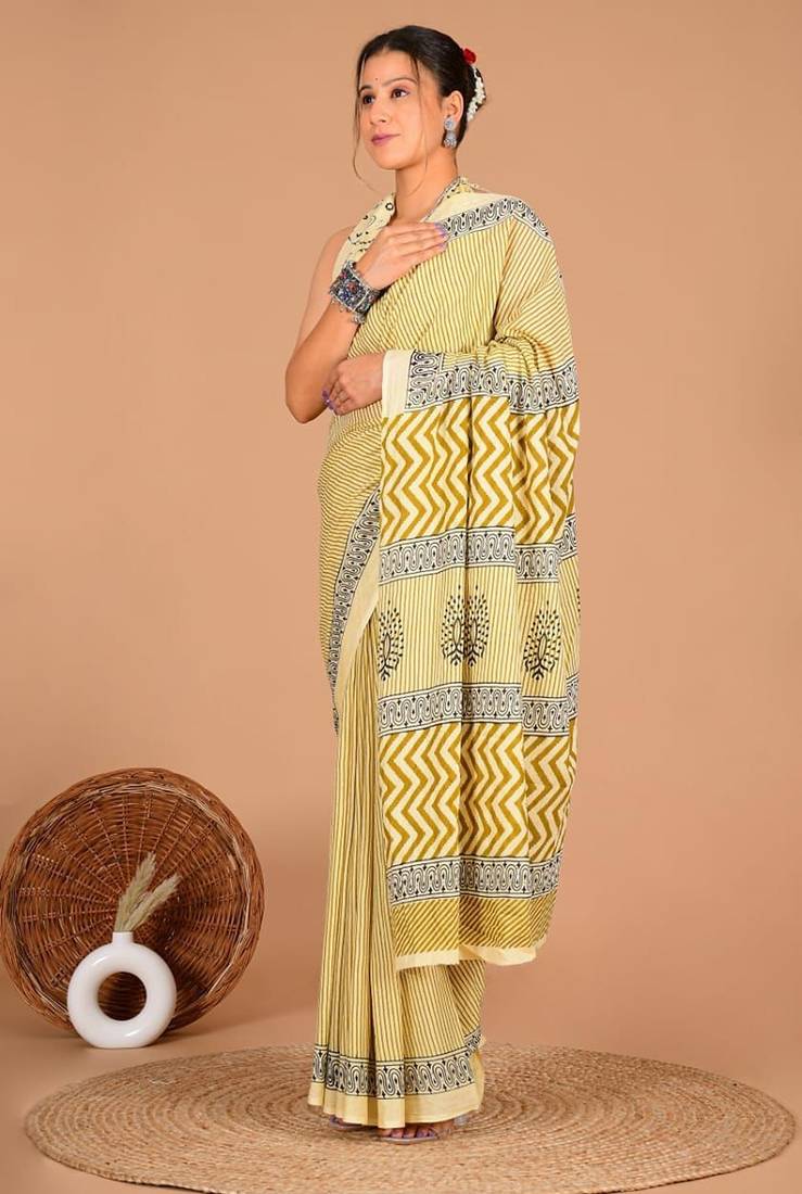 Yellow soft mul cotton saree with unstiched attached blouse piece
