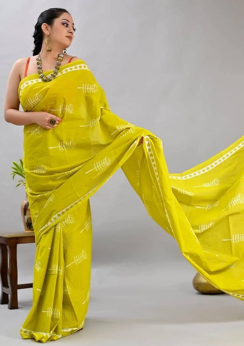 Yellow soft mul cotton saree with unstiched attached blouse piece