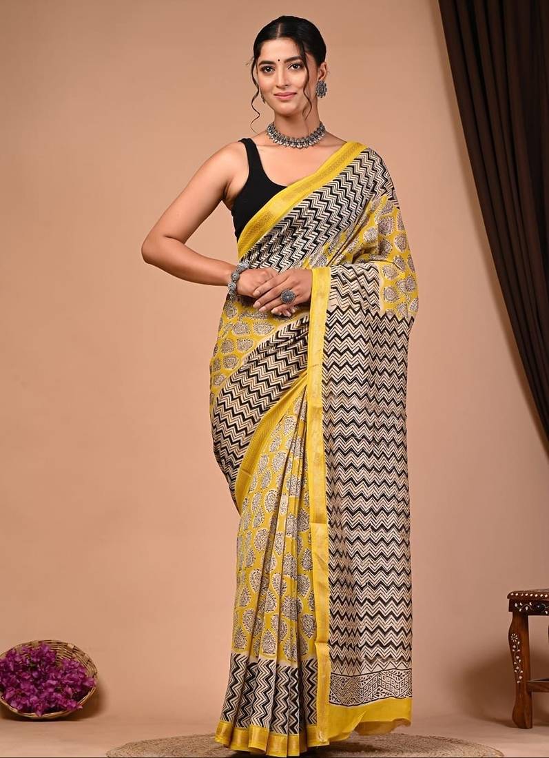 Yellow maheshwari silk saree with woven borders and beautiful hand block print