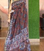 Brown maheshwari silk saree with woven borders and beautiful hand block print