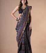 Black maheshwari silk saree with woven borders and beautiful hand block print