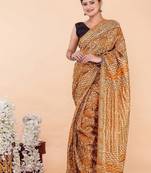 Orange maheshwari silk saree with woven borders and beautiful hand block print