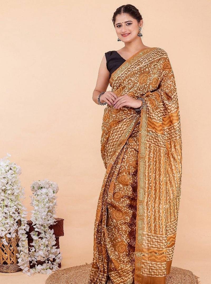 Orange maheshwari silk saree with woven borders and beautiful hand block print