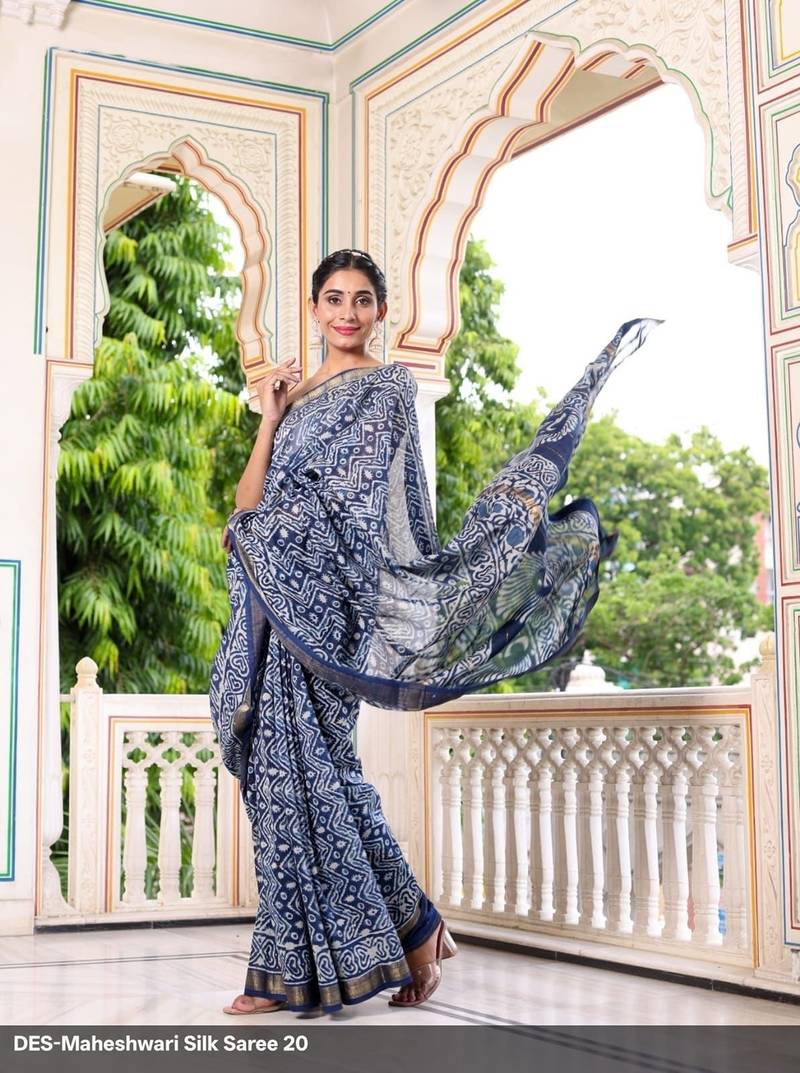 Blue maheshwari silk saree with woven borders and beautiful hand block print