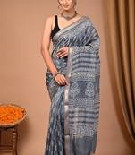 Grey maheshwari silk saree with woven borders and beautiful hand block print