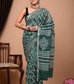 Green maheshwari silk saree with woven borders and beautiful hand block print