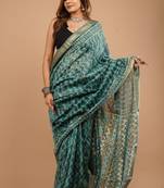 Green maheshwari silk saree with woven borders and beautiful hand block print