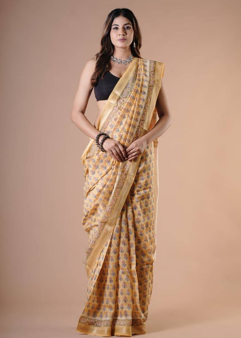 Light yellow maheshwari silk saree with woven borders and beautiful hand block print