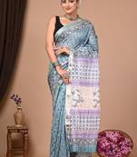 Light grey maheshwari silk saree with woven borders and beautiful hand block print