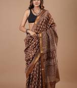Brown maheshwari silk saree with woven borders and beautiful hand block print