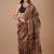Brown maheshwari silk saree with woven borders and beautiful hand block print