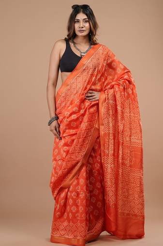 Orange maheshwari silk saree with woven borders and beautiful hand block print