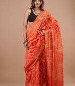 Orange maheshwari silk saree with woven borders and beautiful hand block print