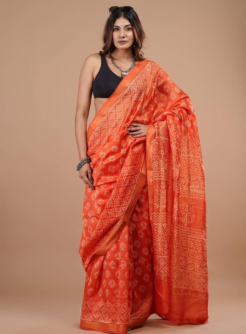 Orange maheshwari silk saree with woven borders and beautiful hand block print