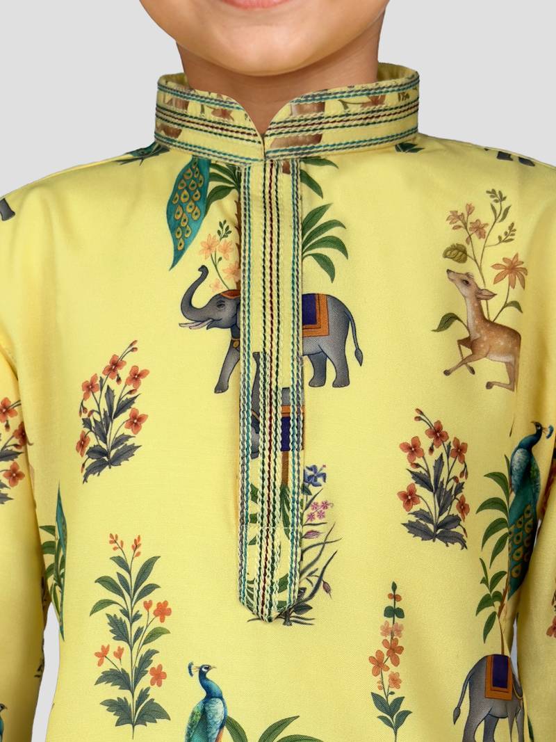 Boys yellow rayon all-over digital animal print kurta cream pant set