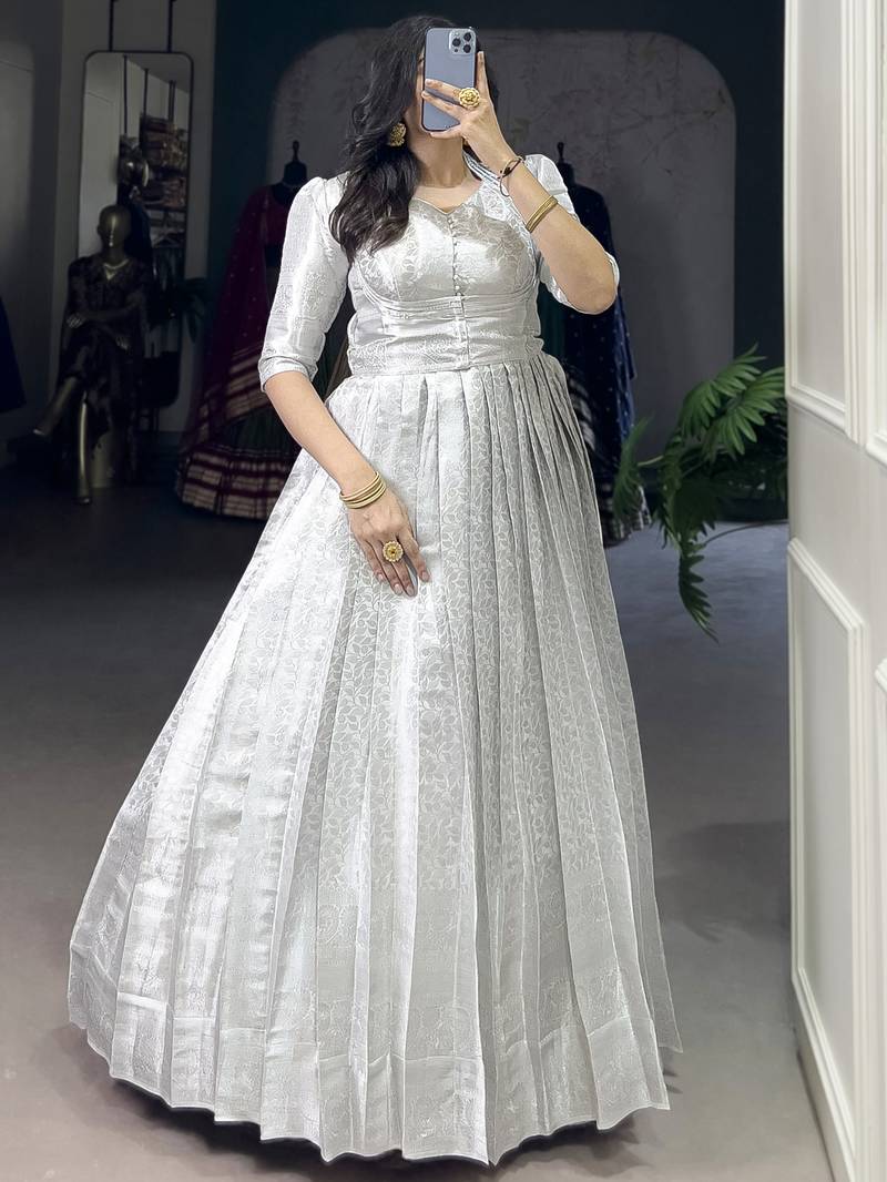 Awesome Off-White Zari Weaving Silk Festive Wear Gown With Koti