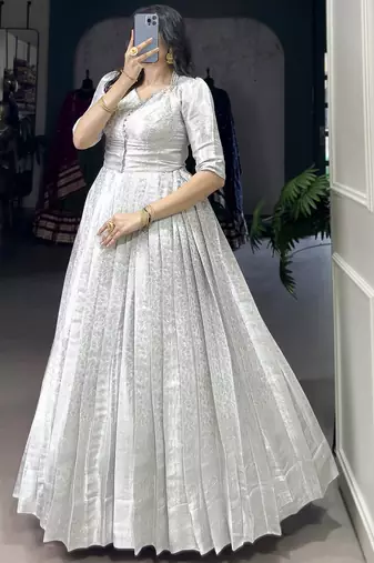 Awesome Off-White Zari Weaving Silk Festive Wear Gown With Koti