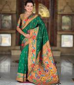 Green elegant art silk woven saree with rich zari border