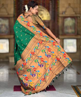 Green elegant art silk woven saree with rich zari border 2