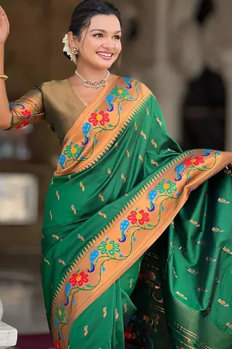 Green elegant art silk woven saree with rich zari border
