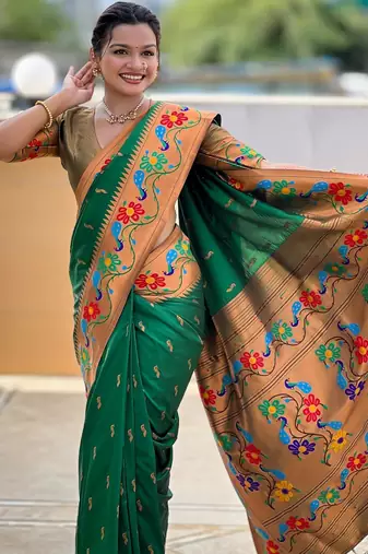 Green elegant art silk woven saree with rich zari border
