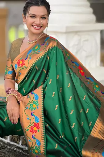 Green elegant art silk woven saree with rich zari border