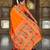 Orange elegant art silk woven saree with rich zari border