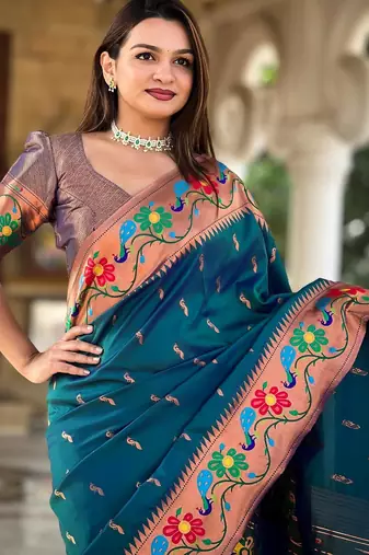 Teal elegant art silk woven saree with rich zari border