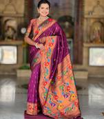 Wine elegant art silk woven saree with rich zari border