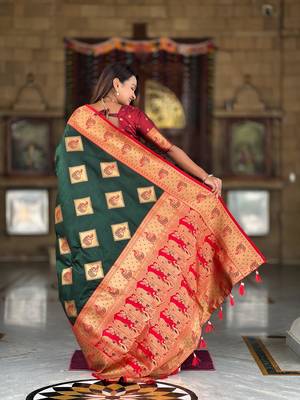 Green elegant art silk woven saree with rich zari border 2