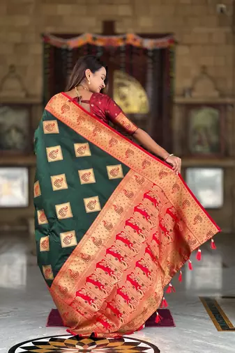 Green elegant art silk woven saree with rich zari border