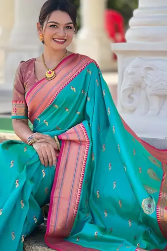 Rama green elegant art silk woven saree with rich zari border