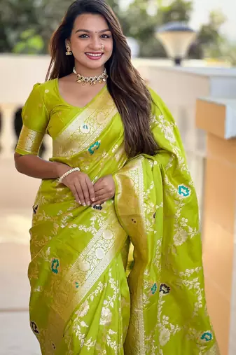 Green elegant art silk woven saree with rich zari border