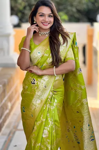 Green elegant art silk woven saree with rich zari border
