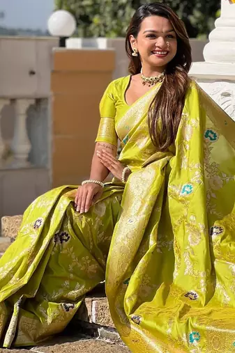 Green elegant art silk woven saree with rich zari border