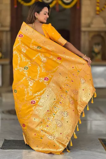 Yellow elegant art silk woven saree with rich zari border