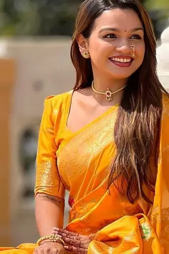 Yellow elegant art silk woven saree with rich zari border