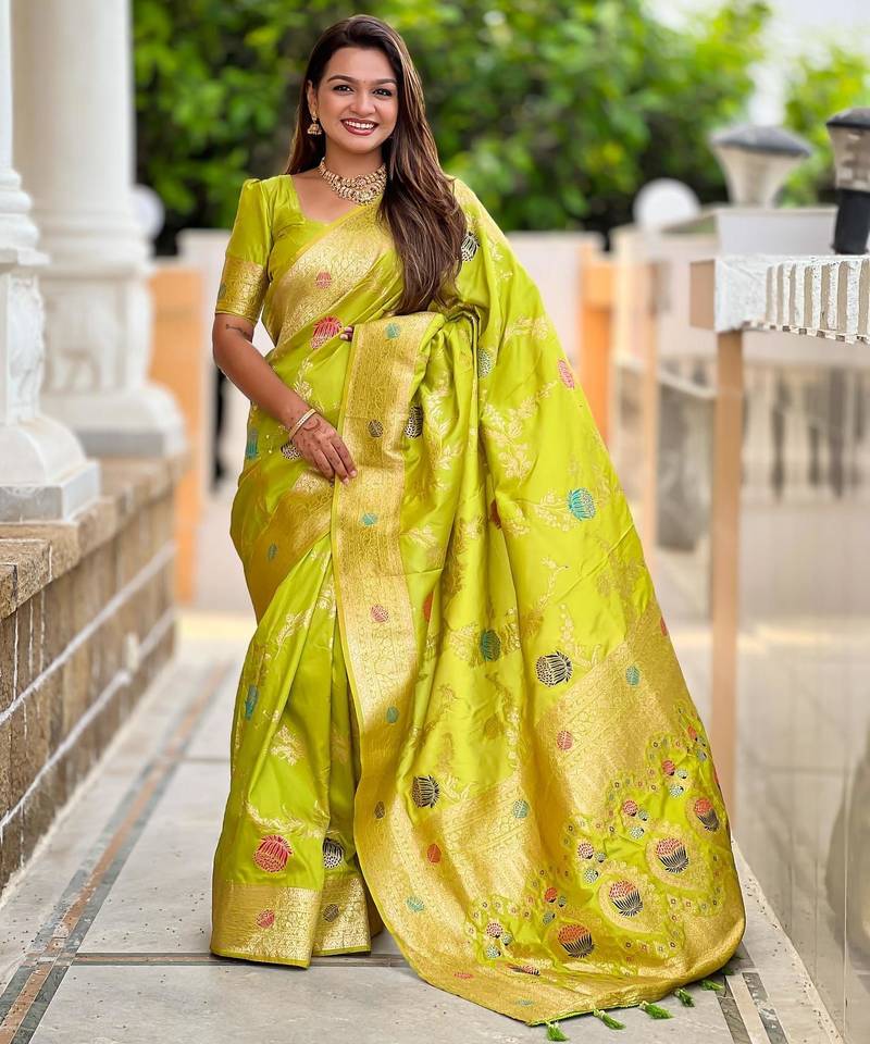 Green elegant art silk woven saree with rich zari border