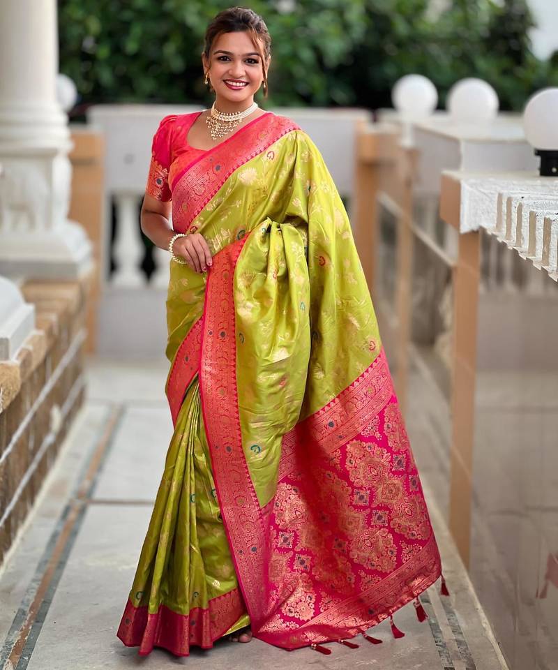 Green elegant art silk woven saree with rich zari border