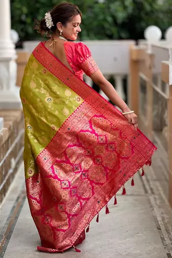 Green elegant art silk woven saree with rich zari border