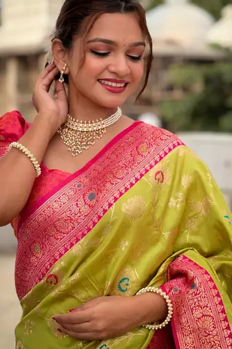 Green elegant art silk woven saree with rich zari border