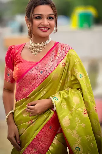 Green elegant art silk woven saree with rich zari border
